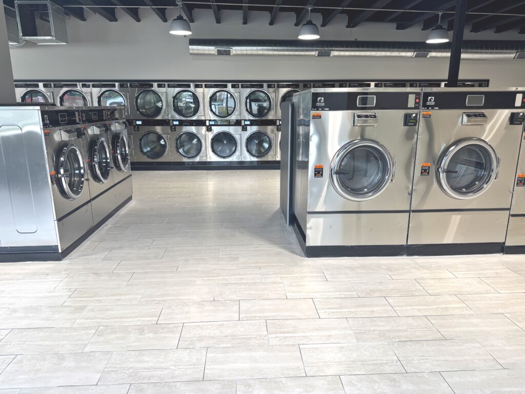 large-capacity-washers-comforters-quick-wash Clean, well-maintained laundromat facility with folding areas